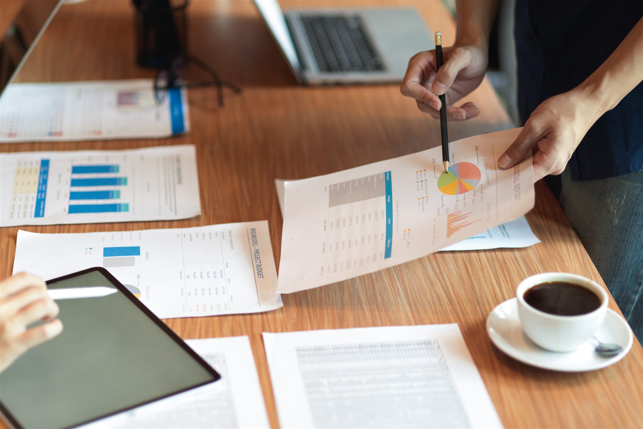 Research reports and data charts on a desk